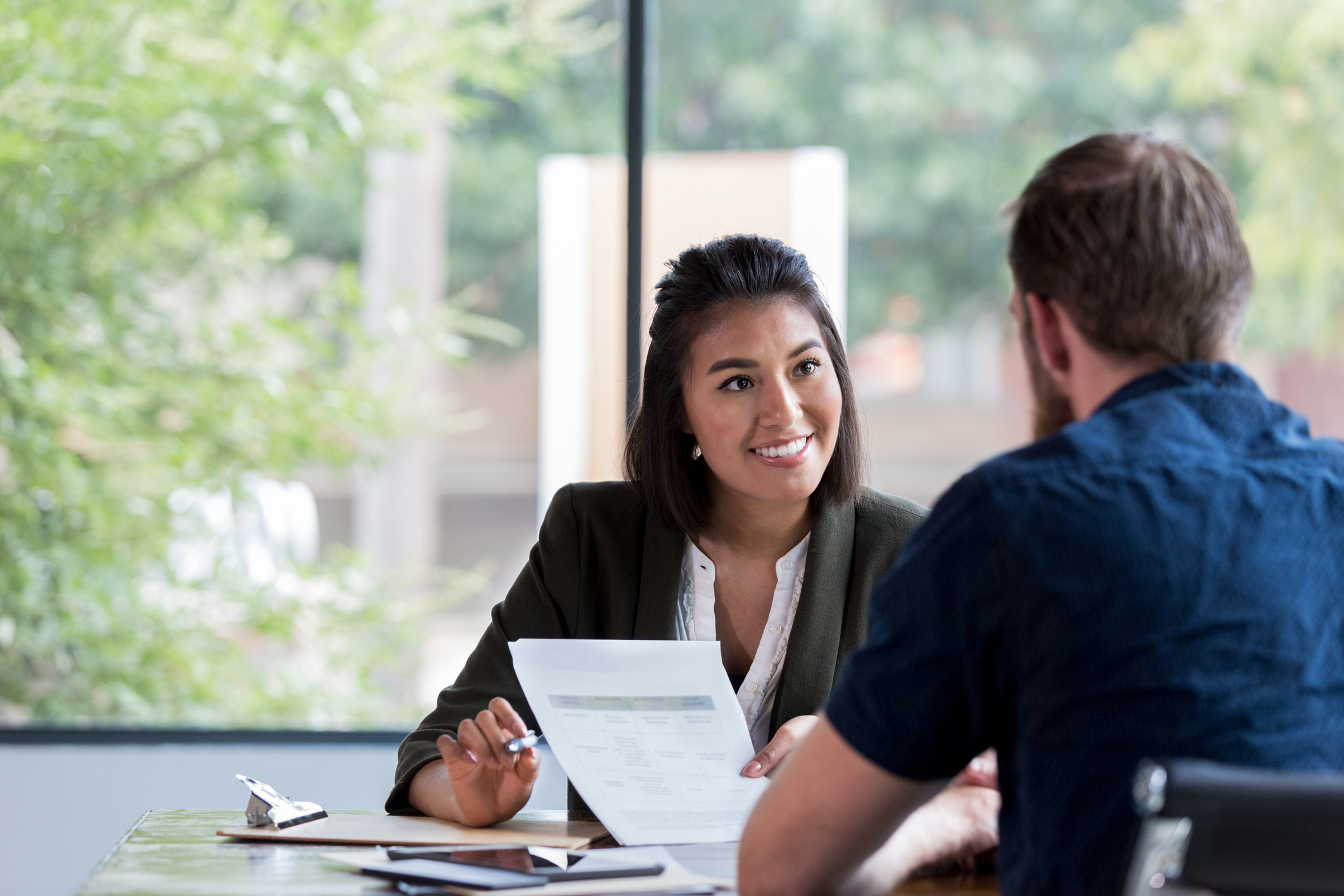 Cheerful businesswoman meets with client Save money for your patients with Annexus Health