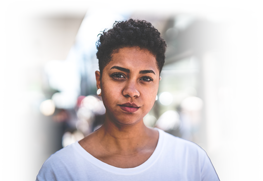 Woman looking straight at camera in white t-shirt